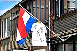 04-06-2020 Breda - Al weken hangen er in de stad vlaggen van studenten die geslaagd zijn. Deze  met een verpleegster op het tshirt is vanwege de Coronacrisis wel de meest bijzondere die afgelopen weken wapperde in Breda. - Fotokrant