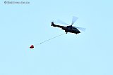 09-08-2022 Breda - Een helikopter die nabij Ouddorp en de Brouwersdam een grote duinbrand heeft geblust vliegt over de Haagse Beemden terug naar de vliegbasis Gilze Rijen. - Fotokrant