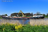 19-04-2023 Breda - Niet ver van de wijk Haagse Beemden zijn al tientalle schepen met zand gelost. Men legt hier een groot zanddepot aan om van daaruit de afgekeurde dijken op te hogen. De dijkverhoging is noodzakelijk omdat het water stijgt. - Fotokrant